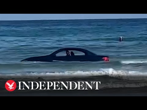 BMW washed out to sea on Cornish beach rescued by coastguard