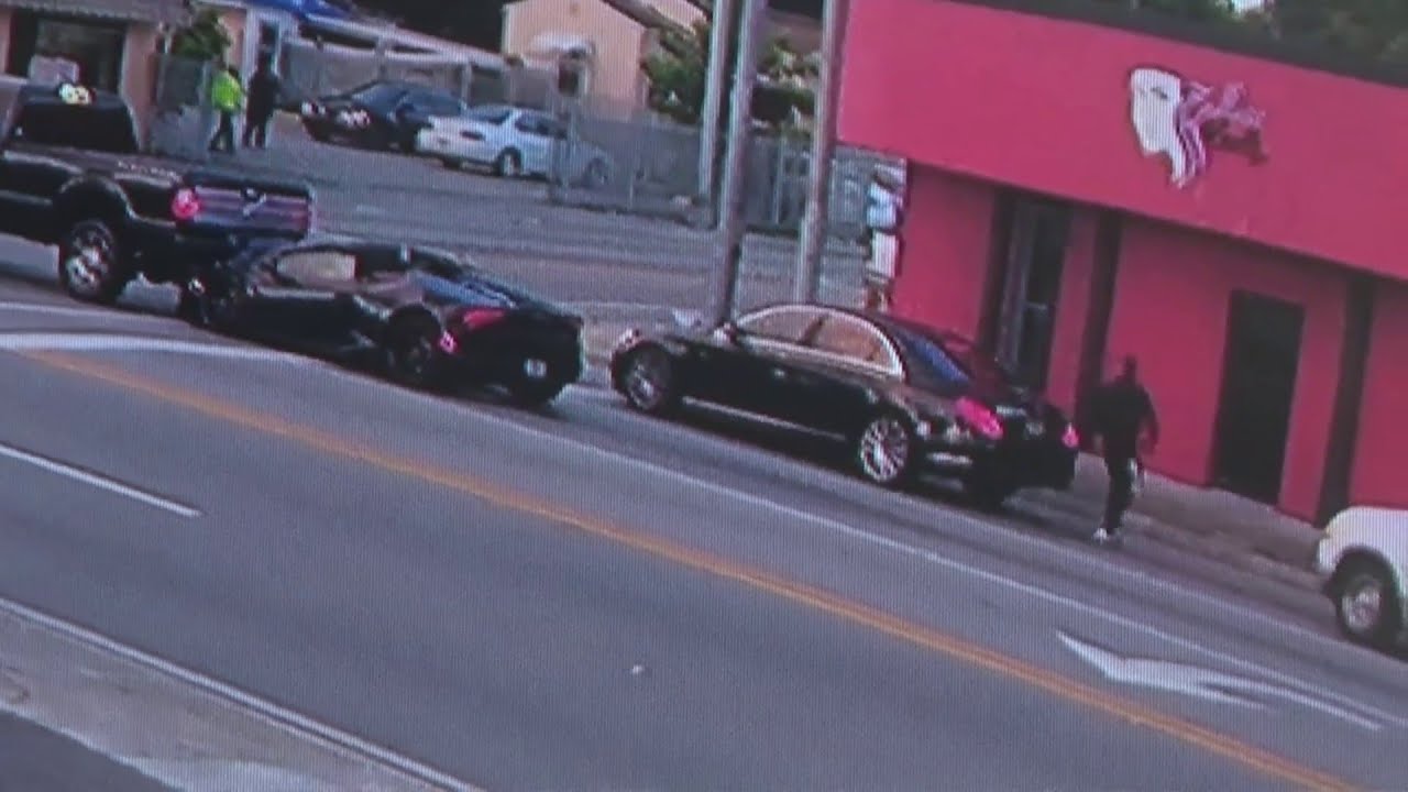 Surveillance video captures driver abandoning sports car after crash