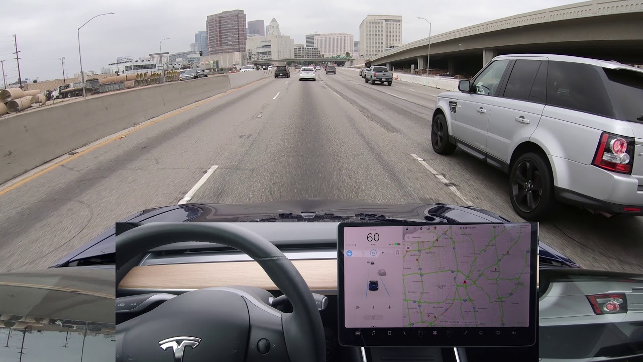 Tesla Autopilot on Narrow Highway with Traffic into Downtown
