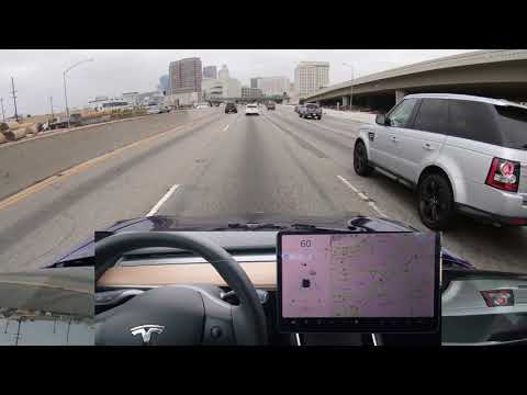 Tesla Autopilot on Narrow Highway with Traffic into Downtown